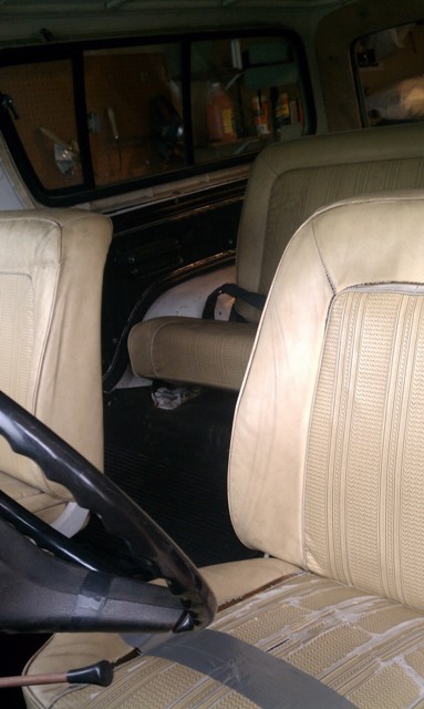 1978 Ford Bronco - Interior view of a 1978 Ford Bronco, highlighting the tan upholstery and dashboard details.