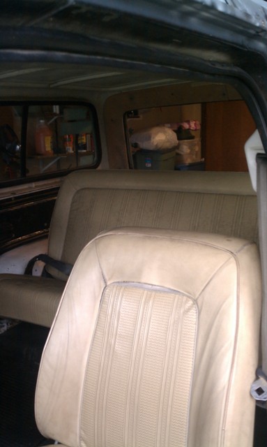 1978 Ford Bronco - Interior view of a vehicle, showing tan striped seats and a Supermotors watermark on the lower right.