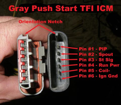 1990 Ford Bronco - Close-up of a gray Ford TFI ignition control module (ICM) electrical connector held in hand, showing the two mating halves with a labeled 6…