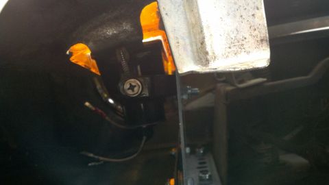 1978 Ford Bronco - Close-up of custom wiring for fog lights, showing tape and mounting hardware.