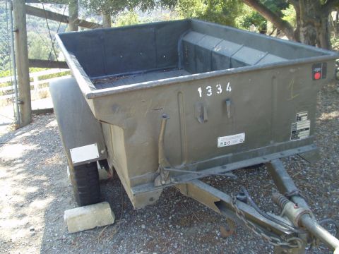 1979 Ford Bronco - A military trailer with visible markings and a trailer hitch is shown from a three-quarter front angle.