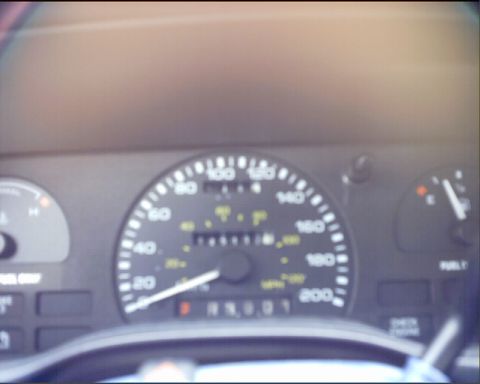 1994 Ford Taurus - The dashboard shows the speedometer, fuel gauge, and odometer with mileage reading 19001.