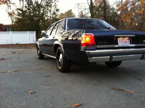 1991 Ford LTD Crown Victoria - Rear view of a 1991 Ford Crown Victoria LTD sedan parked on an asphalt lot.