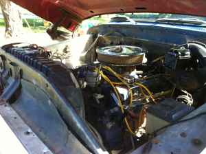 1995 Ford Bronco - Close-up view of the engine compartment of a vehicle, showing the V8 engine and associated components.