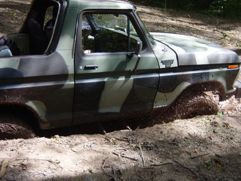 1979 Ford Bronco - This 1979 Ford Bronco is shown navigating a muddy off-road trail.