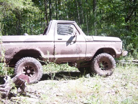 1979 Ford Bronco - This 1978 Ford Bronco is covered in mud and appears to be in a wooded area.