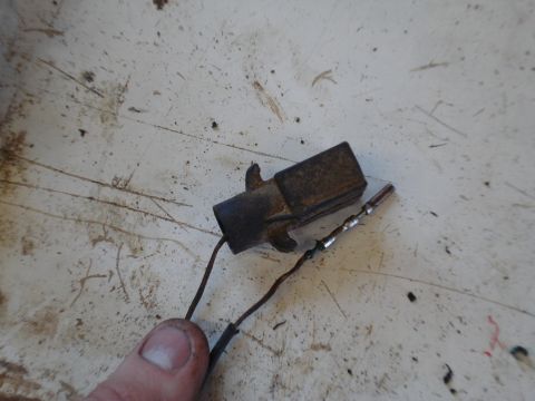 1989 Ford F-250 - A close-up view of a corroded electrical connector with exposed wires.
