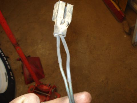 1989 Ford F-250 - Close-up of an electrical connector with two wires, likely a replacement part.