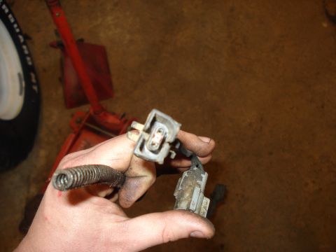 1989 Ford F-250 - Close-up of an electrical connector and wiring harness, possibly for a vehicle drivetrain component.
