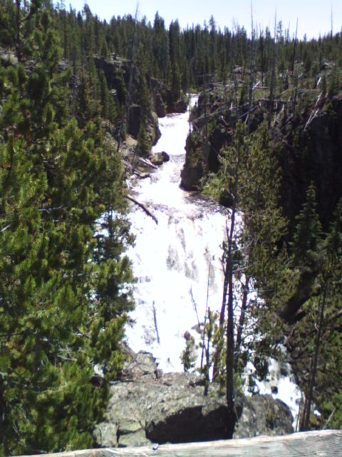2007 Dodge Caliber - A scenic view of a waterfall flowing through a forested canyon.