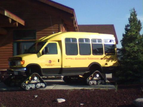 2007 Dodge Caliber - This yellow bus has been modified with tracks for snow travel.