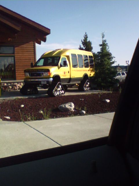 2007 Dodge Caliber - This yellow van has been modified with tracks for off-road capability.