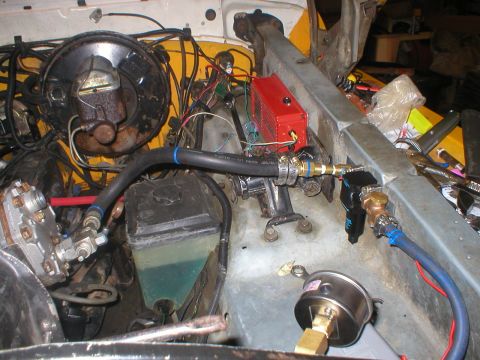 1978 Ford Bronco - Custom components installed in the engine bay, including a red electronic box and various hoses and gauges.