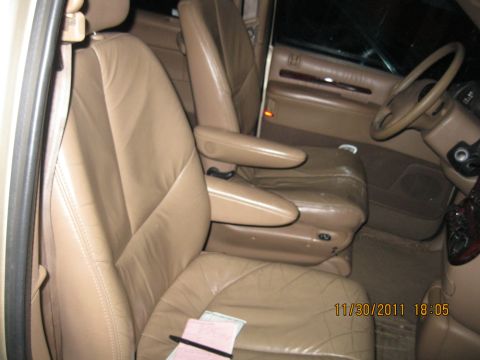 1984 Chevrolet C/K Pickup - Interior view of a vehicle tan leather captain's chairs and a steering wheel, with a date stamp of 11/30/2011.