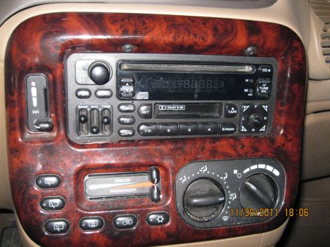 1984 Chevrolet C/K Pickup - The dashboard features a CD/tape player, climate controls, and buttons for various vehicle functions.