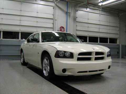 1988 Mercury Grand Marquis - Front view of a white Dodge Charger, likely from the mid-2000s, parked inside a garage.