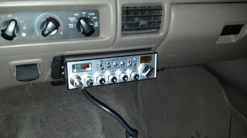 1996 Ford Bronco - CB radio installation in a vehicle interior, showing climate controls and dashboard.