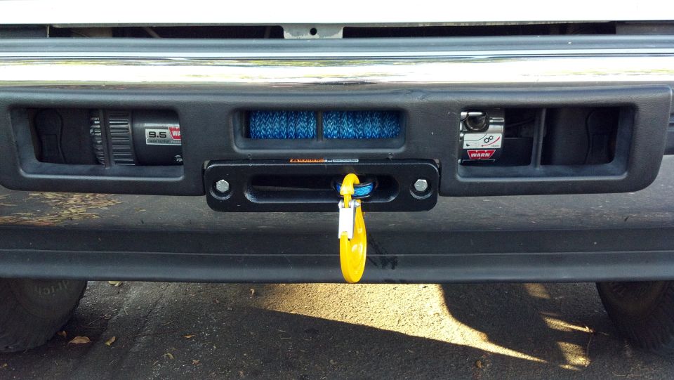 Front bumper with a Warn 9.5 winch and blue rope, and a yellow shackle