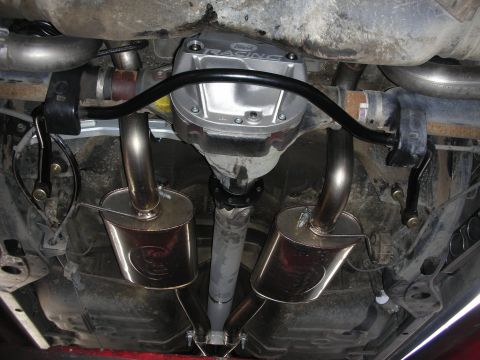 2004 Ford Crown Victoria - Underside view of a rear differential with a Ford Racing cover and a dual exhaust system.