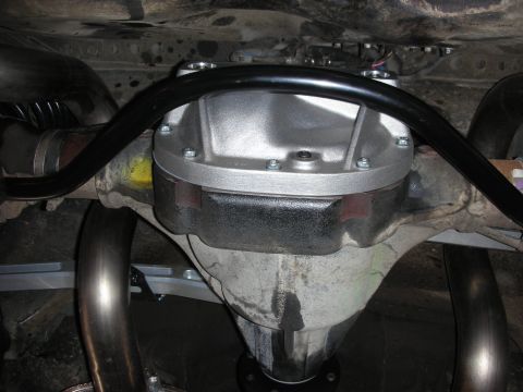 2004 Ford Crown Victoria - Close-up of a vehicle's rear differential and exhaust system, showing recent modifications.