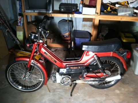 1981 Garelli Rally Sport - A red moped, possibly a Puch Newport II, is stored in a cluttered garage.