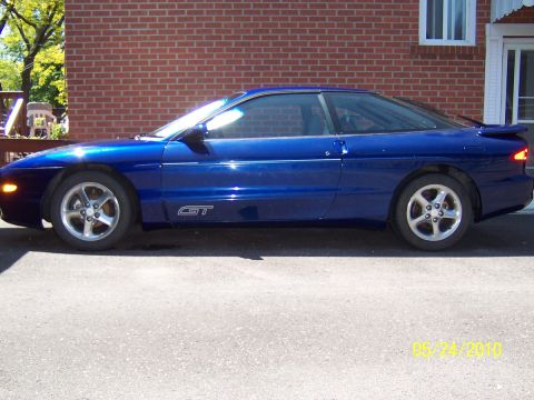 1993 Ford Probe - Side view of a blue 1993 Ford Probe GT with a spoiler and alloy wheels.