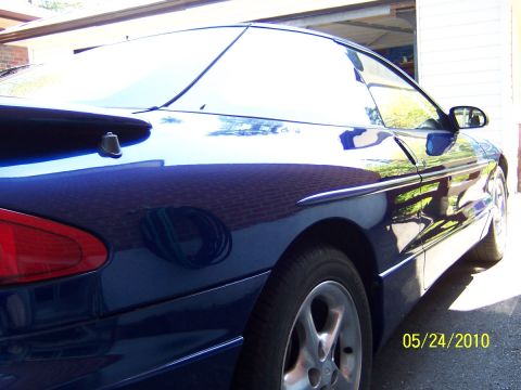 1993 Ford Probe - Rear quarter view of a blue 1993 Ford Probe parked in a driveway.