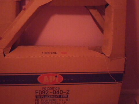 1990 Ford Bronco - A box containing a replacement door shell for a Ford Bronco from 1987-1991.
