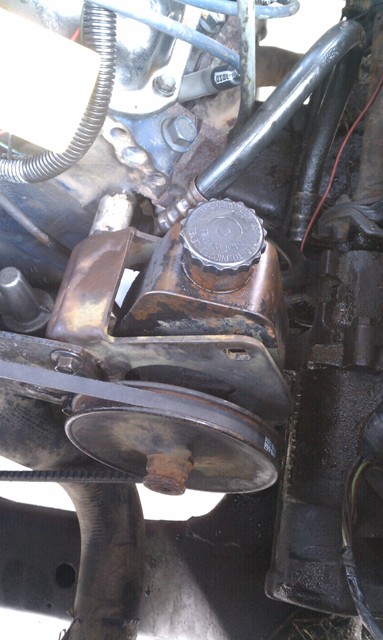 1978 Ford Bronco - Power steering pump and pulley assembly, likely from an older vehicle.