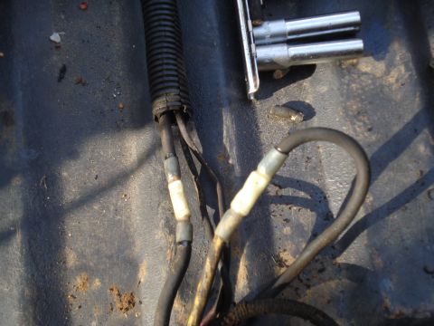 1989 Ford F-250 - Engine wiring harness and socket wrenches are visible in this close-up shot.