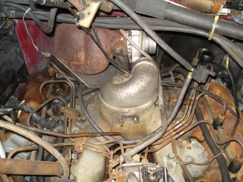 1989 Ford F-250 - Close-up view of the engine bay, focusing on the turbocharger and various fuel lines.