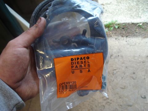 1989 Ford F-250 - A DIPACO Diesel Parts injector hose assembly is shown in its original packaging.