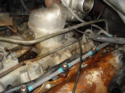 1989 Ford F-250 - Engine bay detail showing fuel lines and associated components.