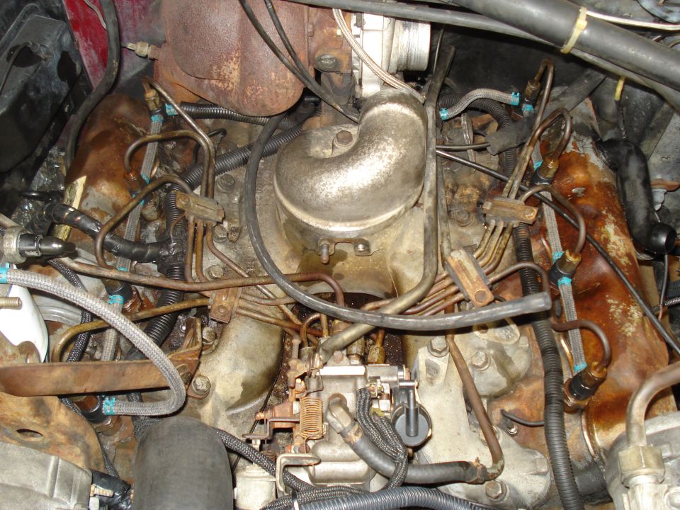 Close-up of diesel engine parts, including fuel lines and turbocharger components