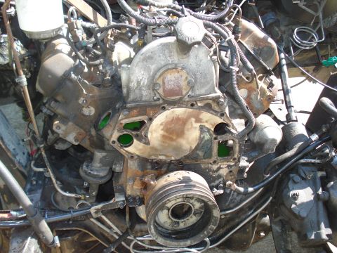 1989 Ford F-250 - Close-up view of a heavily corroded engine, showing internal components and external wiring.