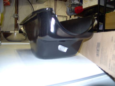 1983 Chrysler Fifth Avenue - A black oil pan is shown, with a label on its side.