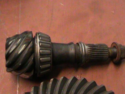 1995 Ford Bronco - Differential ring gear and pinion shaft with bearing shown close up.