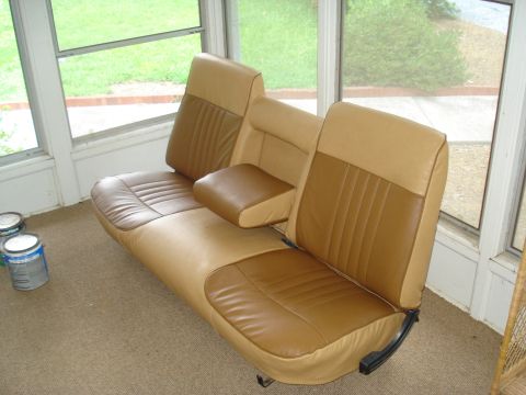 1967 Ford F-250 - This bench seat, a two-tone tan and brown design with vertical stitching, appears to be from a vintage truck or van.