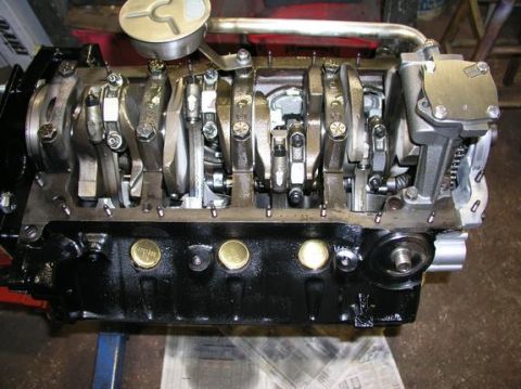 1996 Ford Bronco - Close-up of an engine block, showing internal components like the crankshaft and connecting rods.