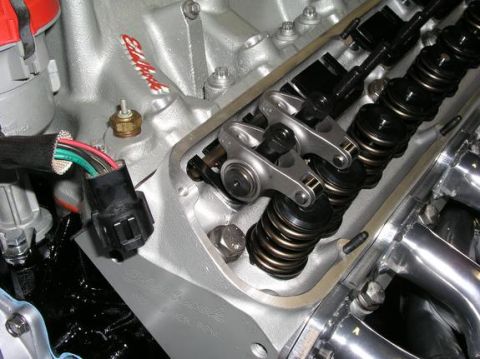 1996 Ford Bronco - Close-up view of an engine's valve train, Edelbrock branding on the intake manifold.