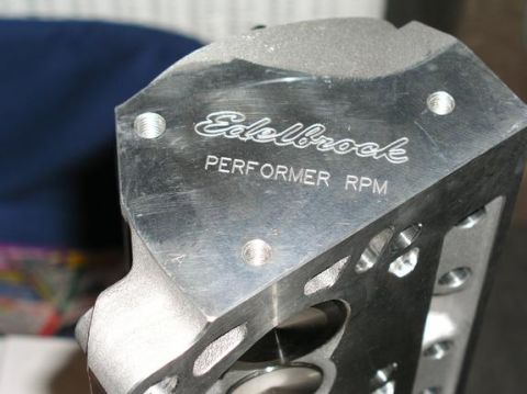 1996 Ford Bronco - Close-up of an Edelbrock Performer RPM engine part, showing engraved branding.
