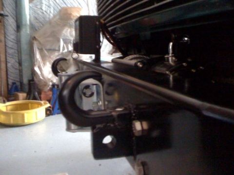 1996 Ford Bronco - Close-up view of a vehicle's front frame section, showing a tow hook and mounting hardware.