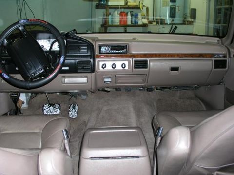 1996 Ford Bronco - The interior of a 1992 Ford F-150 pickup truck is visible, including the dashboard and seats.