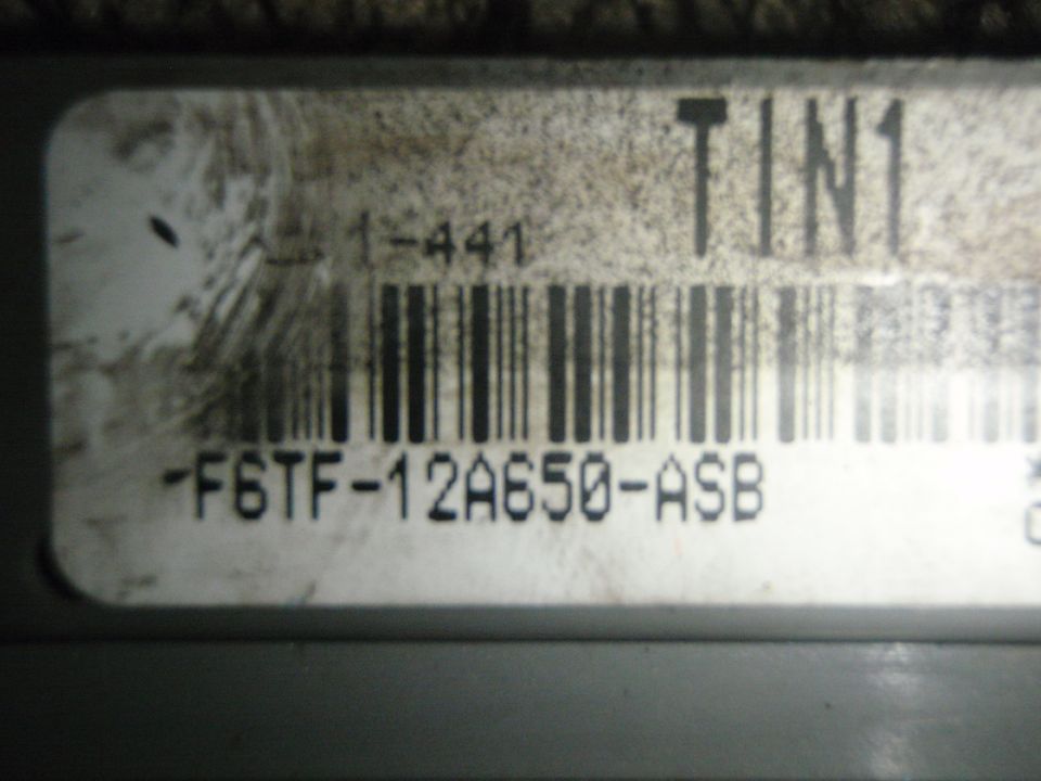 Engine control module label with part number -F6TF-12A650-ASB