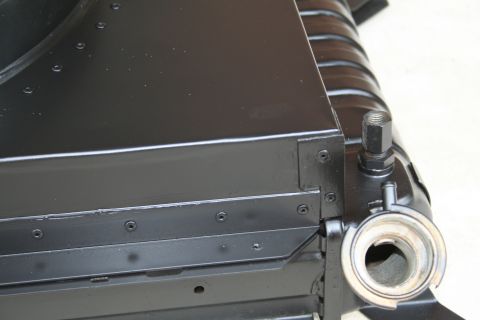 1996 Ford Bronco - Close-up view of a black radiator fan shroud, showing its construction and attachment points.