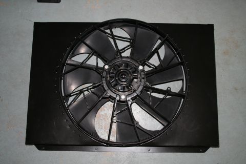 1996 Ford Bronco - A black radiator fan shroud and fan assembly is shown against a dark background.