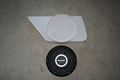 1996 Ford Bronco - A custom car door panel is shown with a Pioneer subwoofer placed below it.