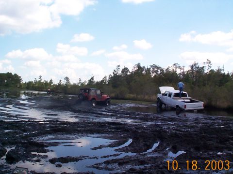 1992 Ford Bronco - This diesel F350 was buried in one of the deep spots of this mud hole. There were some spots out there that would swallow 38's so you had t…