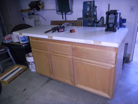 1997 Ford Ranger - A workbench with cabinets is shown, with various tools and supplies in the background.