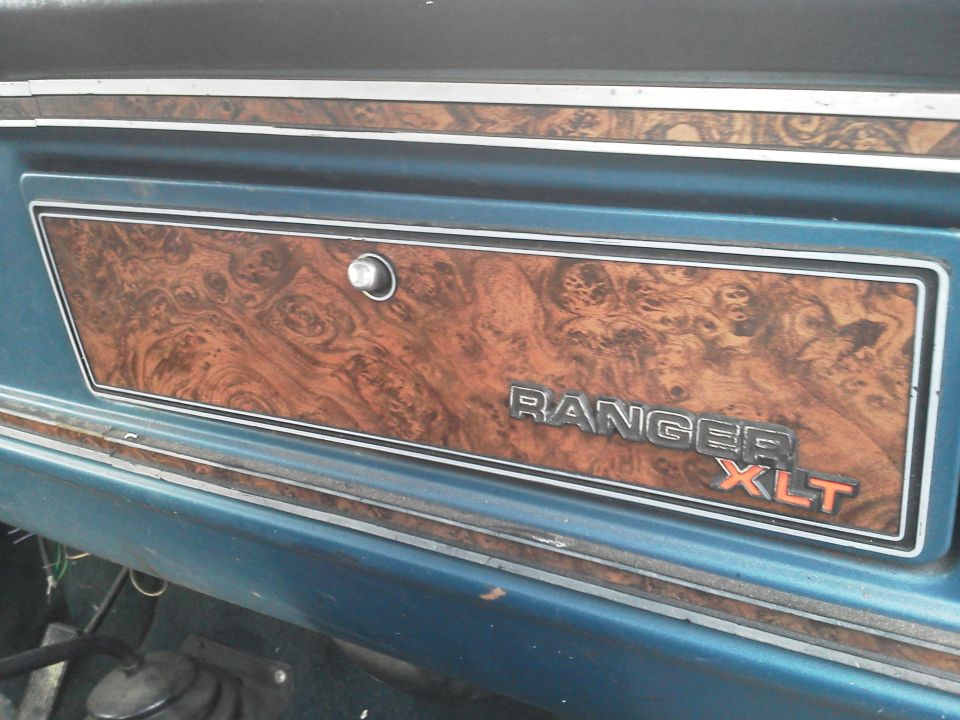 Interior trim panel with wood grain and RANGER XLT badging